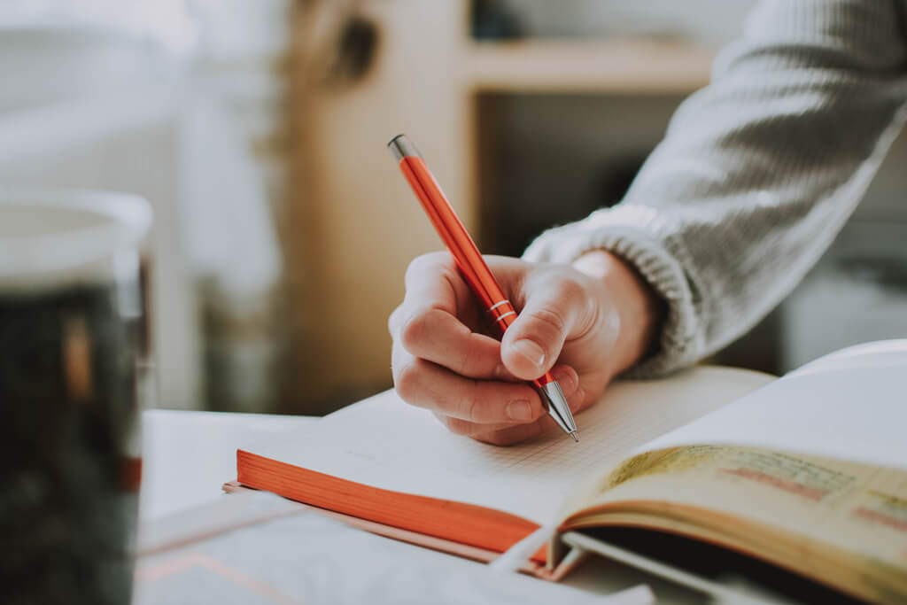 Hand writing in a notebook